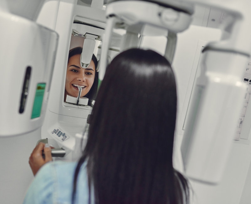 Dentist using advanced dentistry technology to capture x-ray scans