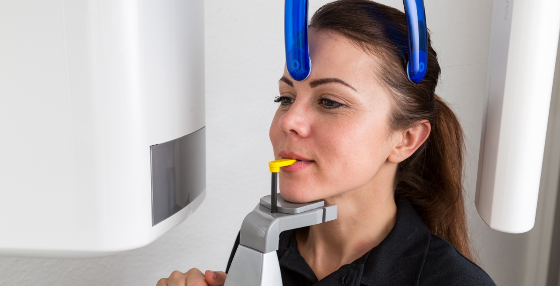 Patient receiving 3 D C T cone beam x-ray scan
