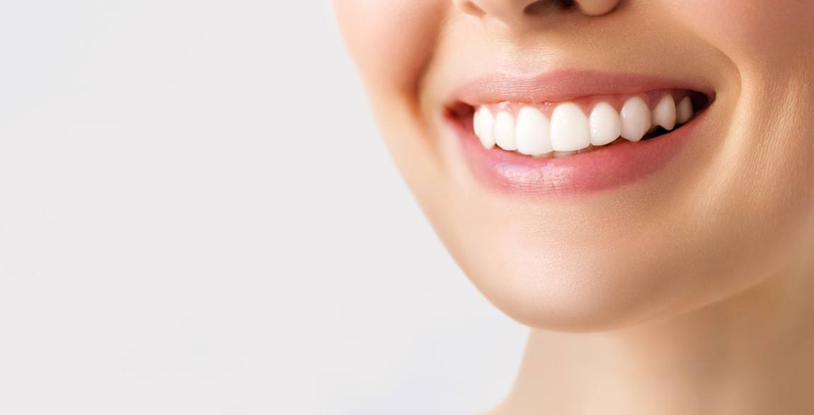 Woman’s smile with a chip out of a front tooth