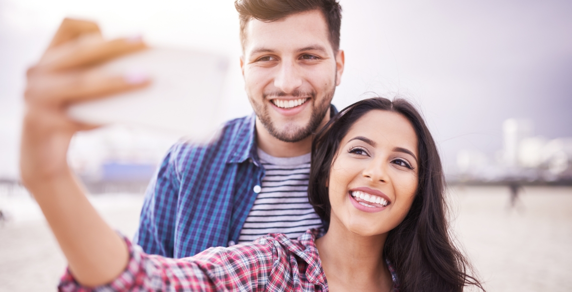 Man and woman smiling after visiting their Delta Dental dentist