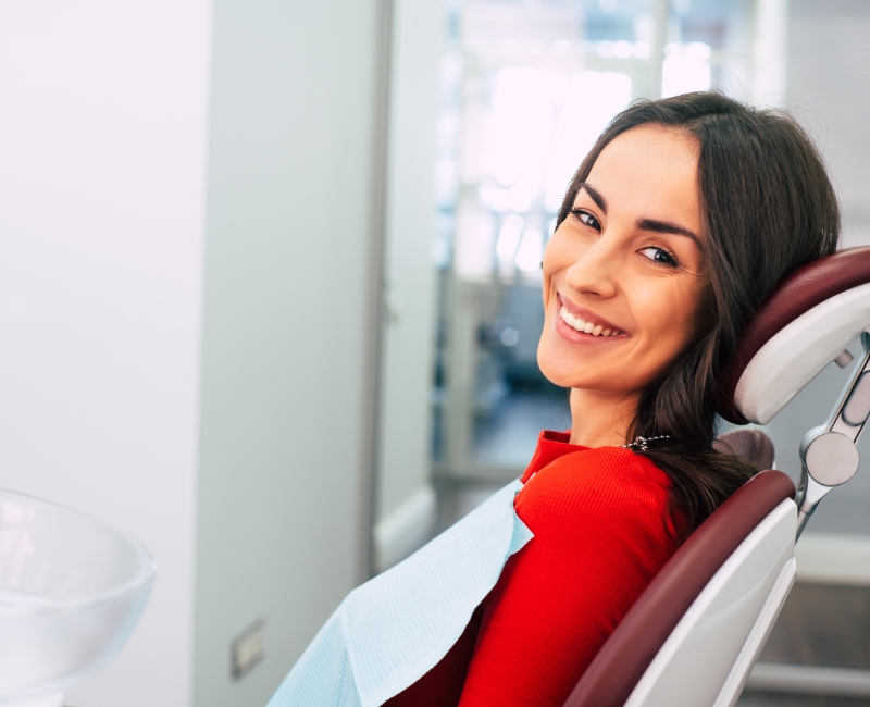 Woman smiling during dental treatment