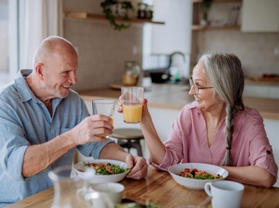 An older couple eating a healthy meal together