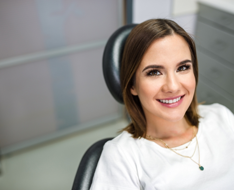 Woman smiling during dental checkup and teeth cleaning