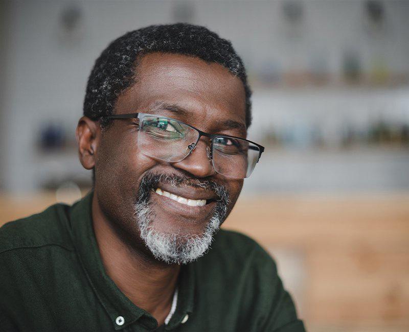 Man with healthy smile after dental office visit