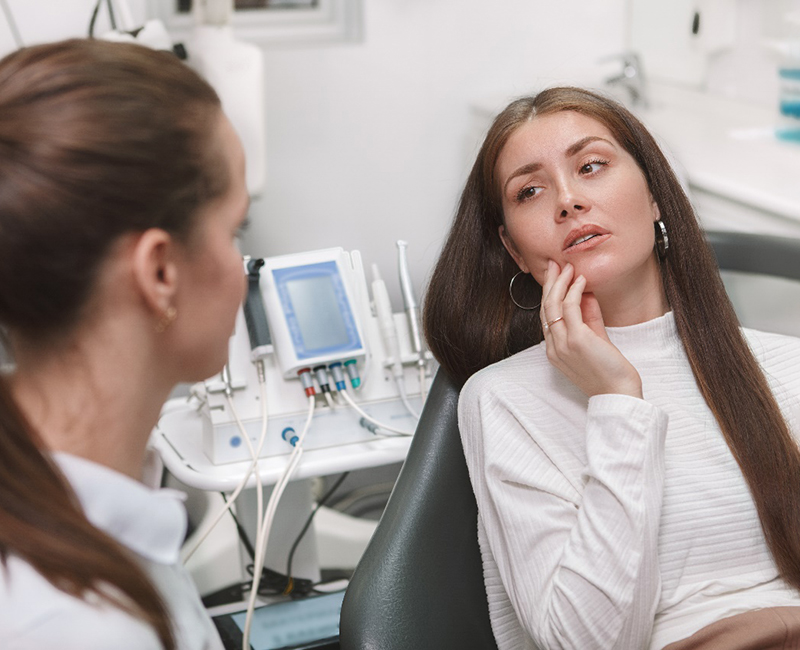 A young woman seeing her emergency dentist in Rochester