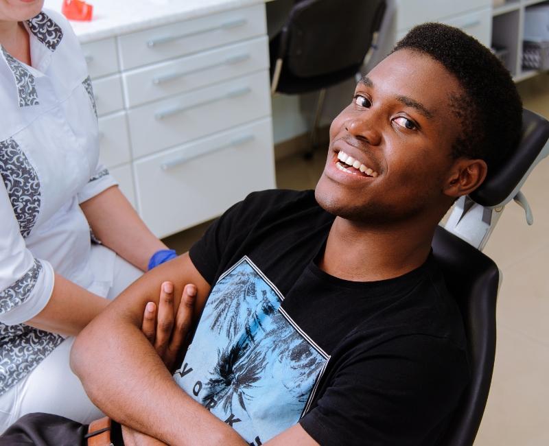 Dental patient smiling in dental chair