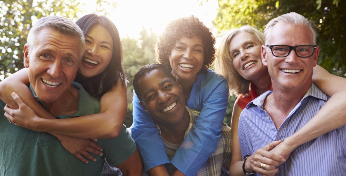 Group of people with healthy smiles after restorative dentistry