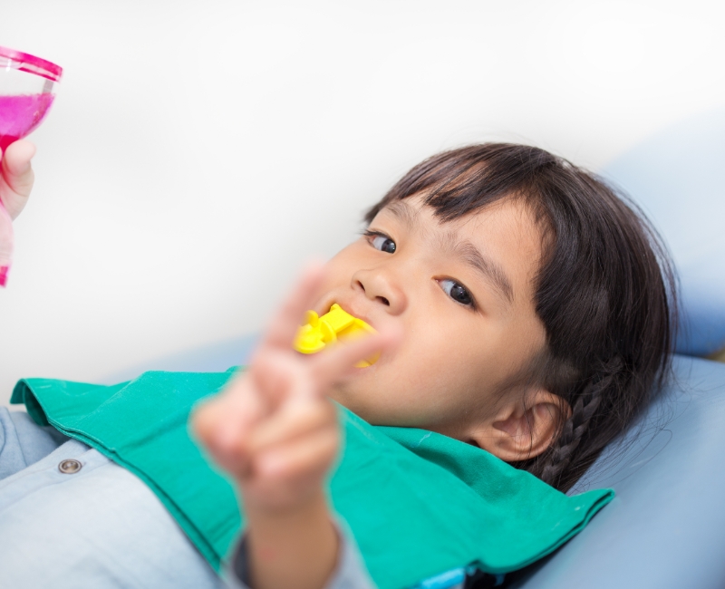 Child receiving fluoride treatment