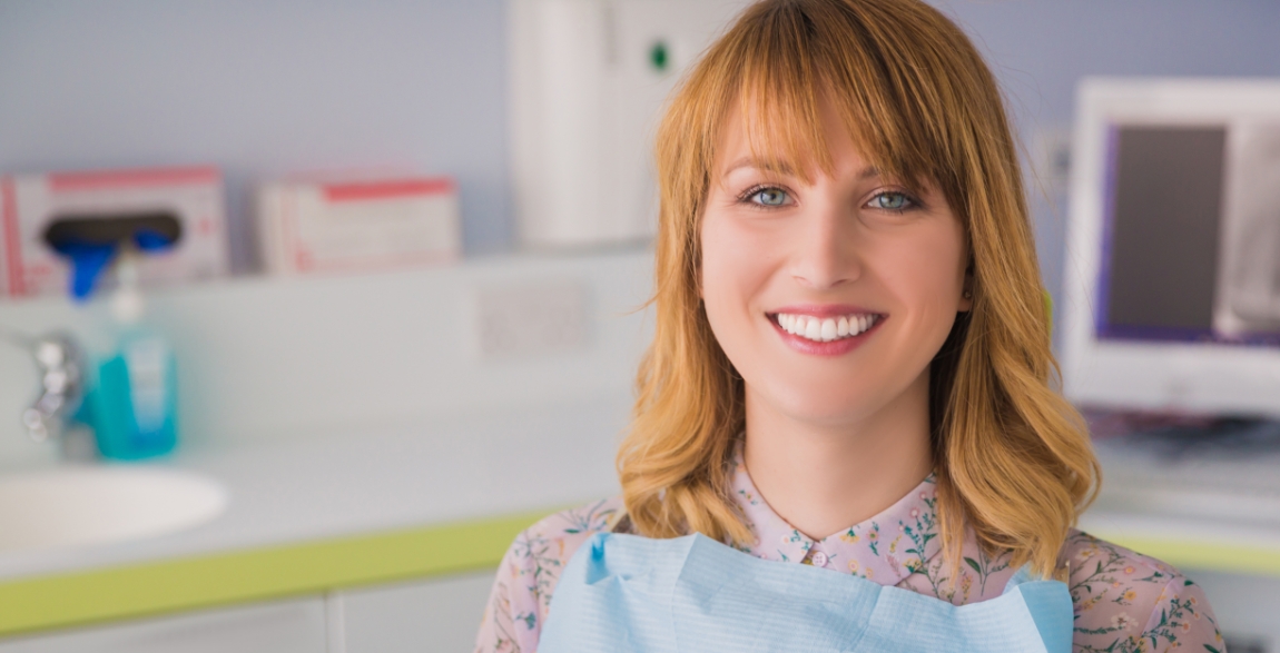 Woman with healthy smile after preventive dentistry