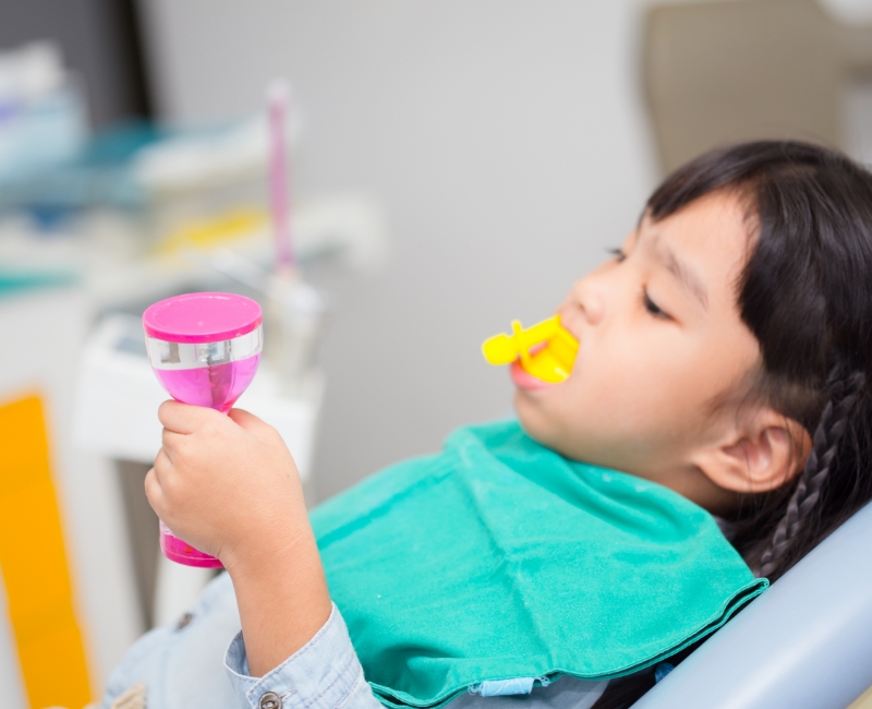 Child receiving fluoride treatment