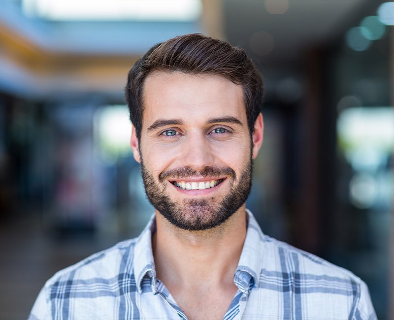 Man's smile enhanced using virtual smile design software