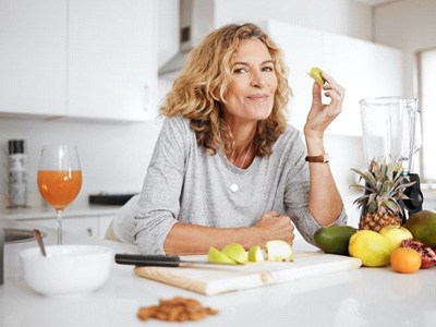 a woman enjoying healthy foods