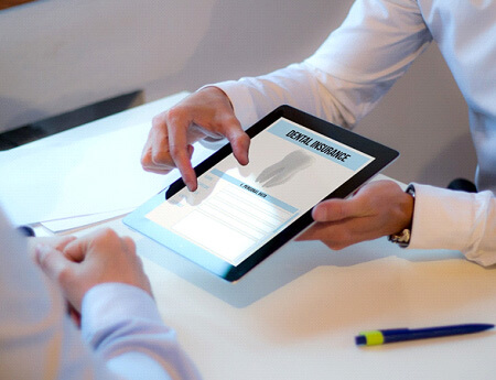 showing a patient dental insurance form on a tablet