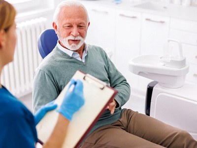 older patient talking in a consultation