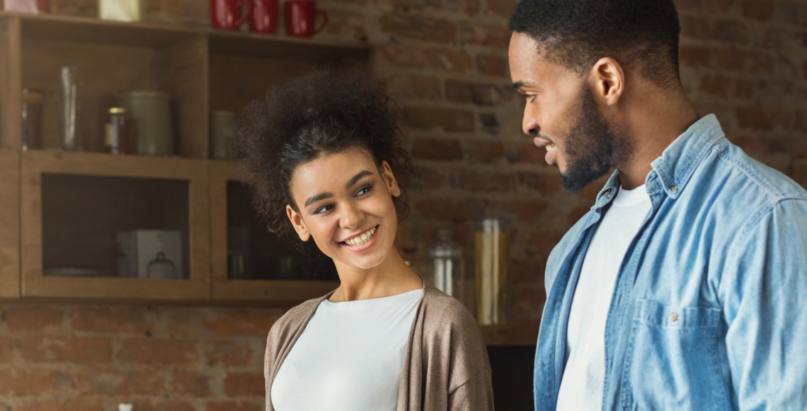 Man and woman smiling together after visiting their MetLife dentist