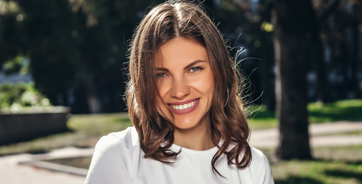 Woman’s smile with a chip out of a front tooth