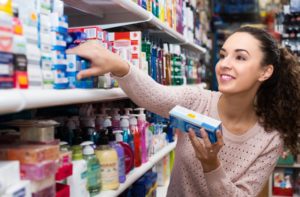 person shopping for toothpaste