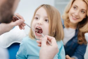 mom and daughter at dentist