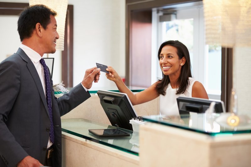 A patient paying for dental services.