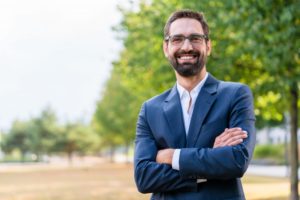 Smiling, successful man feels confident after visiting his cosmetic dentist