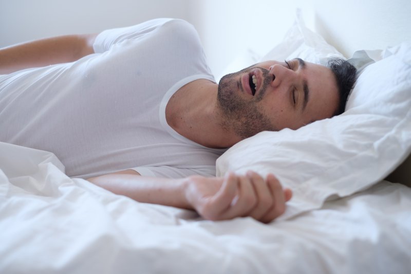 Man sleeping while breathing through his mouth