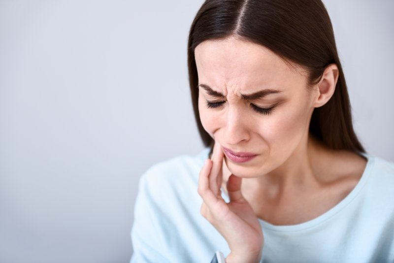 young woman with jaw pain