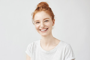 Teenage girl in white shirt smiling
