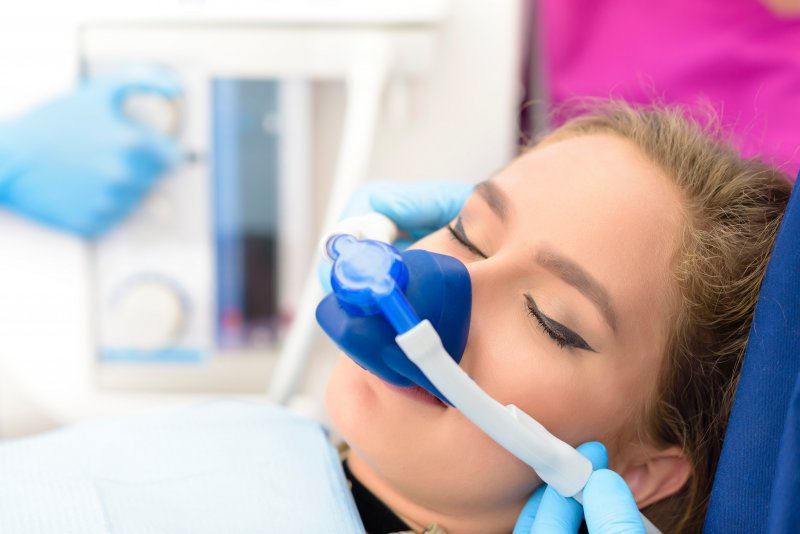 Lady receives nitrous oxide through nose mask