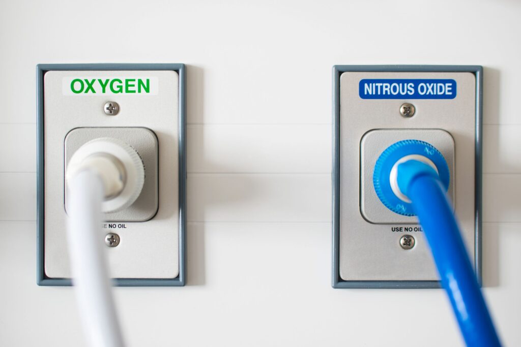 Oxygen and nitrous oxide tubes in wall